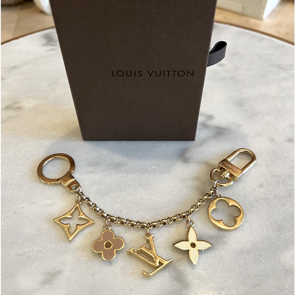 Authentic Louis Vuitton Fleur De Monogram bag chain.